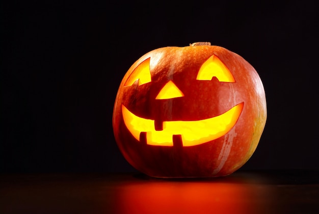 Kind Halloween Pumpkin On A Black Background