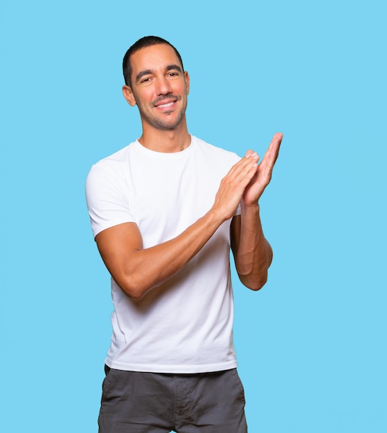 Kind young man applauding gesture