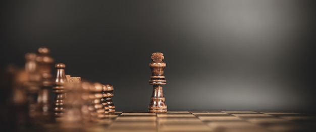 King chess stand on chessboard concepts of competition challenge of leader business team or teamwork volunteer or wining and leadership strategic plan and risk management or team player