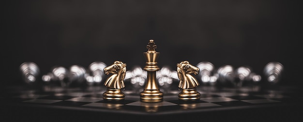 King chess with knight horse stand on chessboard concept of team player or business team and leadership strategy and human resources organization management or goal to win or strong winner