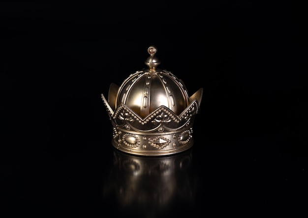 king crown isolated on black background