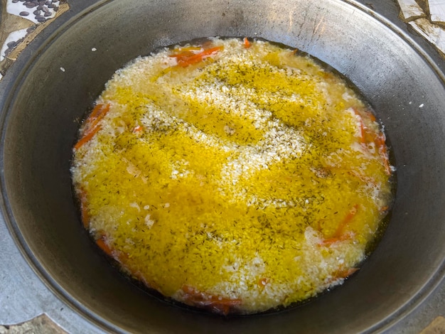 The king dish Plov is being prepared