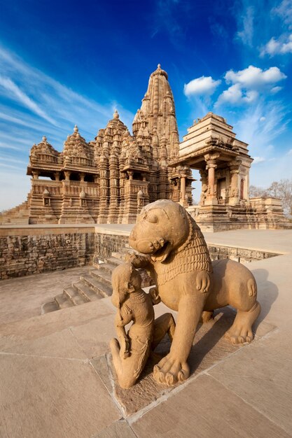 King and lion fight statue and Kandariya Mahadev temple