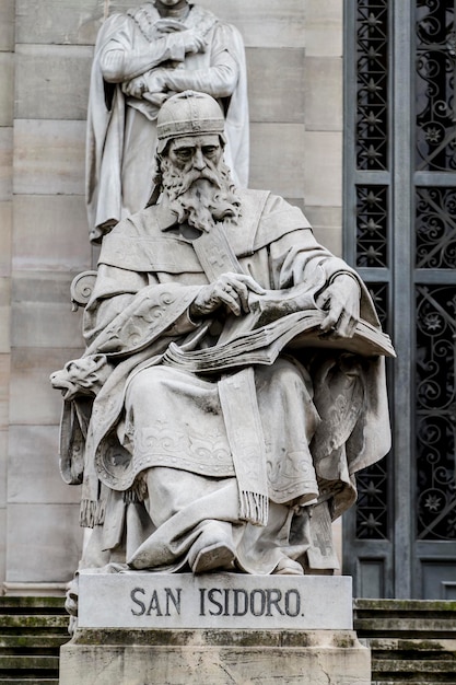 King Sculpture. National library facade in Madrid, Spain