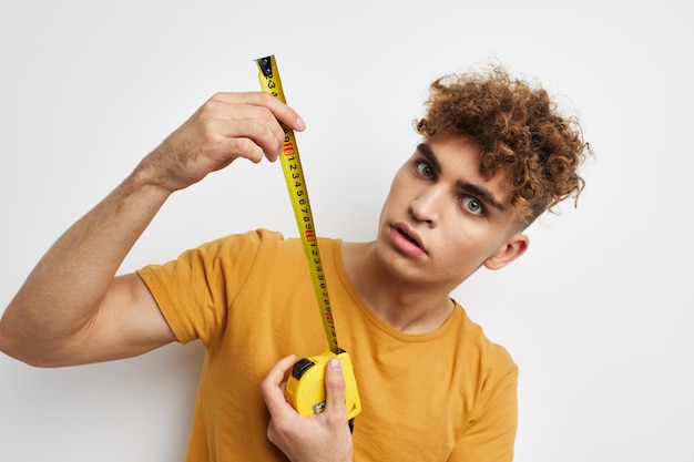 Kinky guy grimace measuring tape posing isolated background