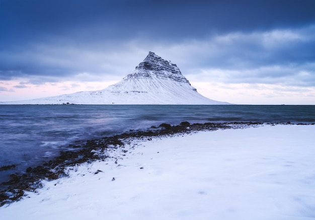 Kirkjufell mountain Iceland Winter landscape The mountain and the ocean Snow and ice A popular place to travel in Iceland