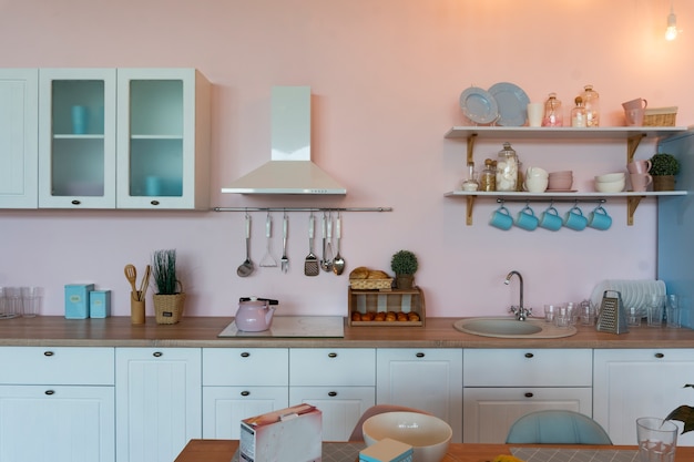 Kitchen interior with large dining table in modern apartment