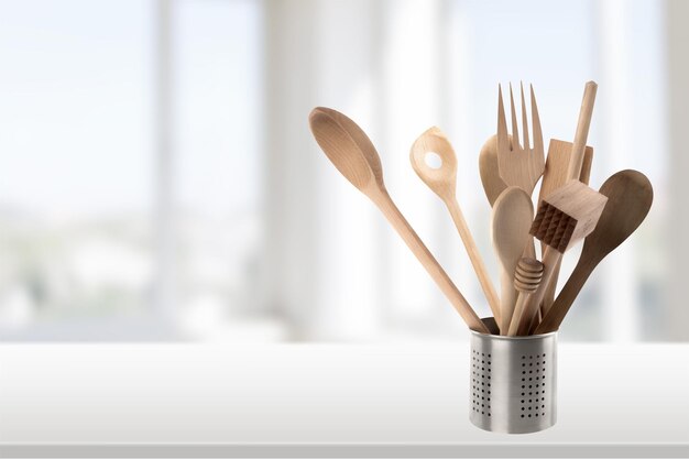 Kitchen metal and wooden utensil on  background