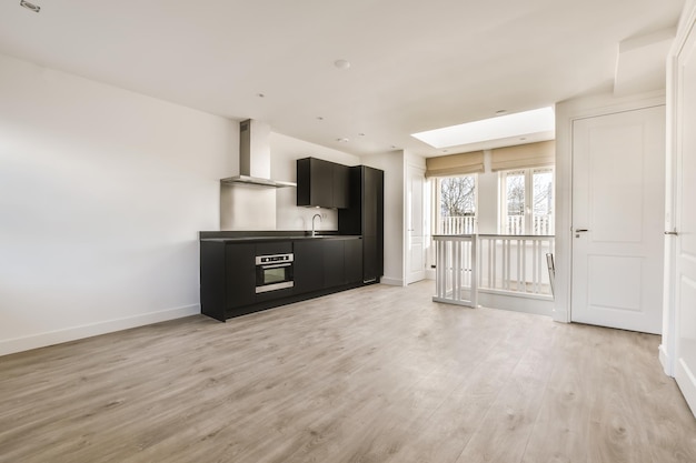 Kitchen in a new luxury home, hardwood floors, dark cabinets