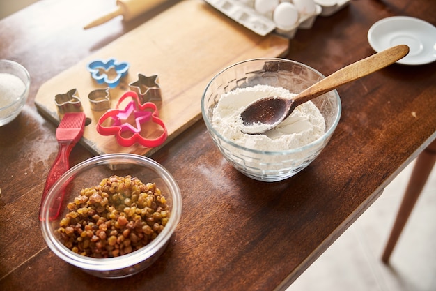 Kitchen table set up with ingredients for baking cookies