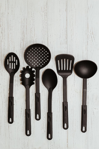 Kitchen tools plastic for multicooker on a wooden table