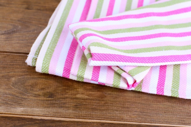 Kitchen towels on wooden background