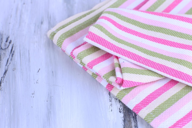 Kitchen towels on wooden background