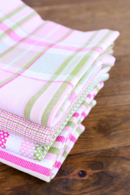 Kitchen towels on wooden background