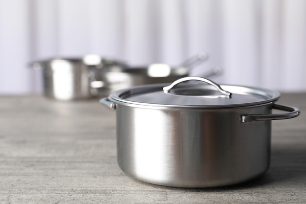 Kitchen utensil on gray textured table, selective focus.