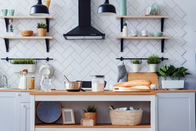 Kitchen utensils for homemade baking on a light wooden kitchen table