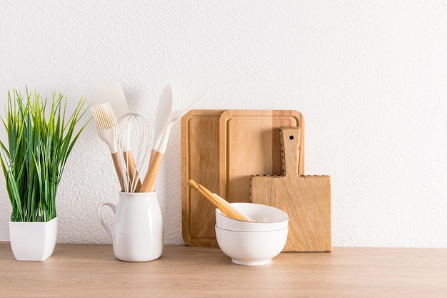 Kitchen utensils wooden planks for cutting indoor flower products on a wooden countertop interior background of the kitchen zero waste