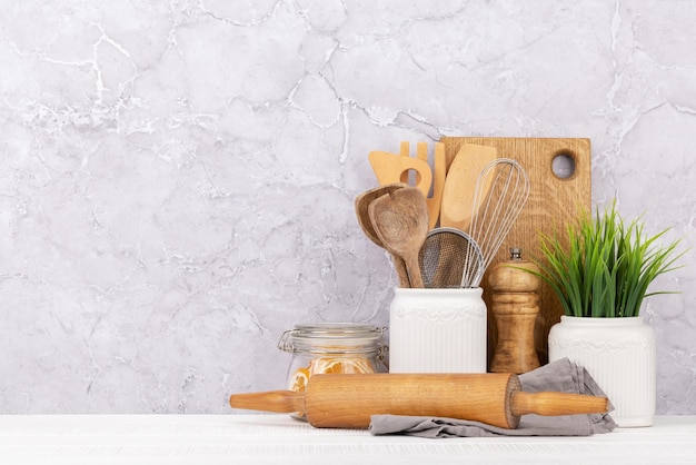 Kitchen utensils on wooden table