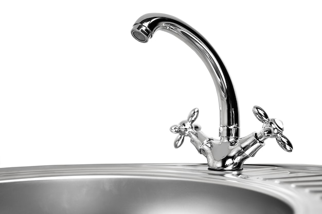 The kitchen water crane is isolated on a white background