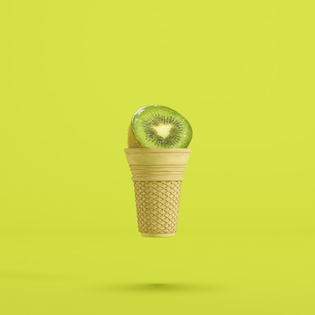 KIWI fruit with Ice cream cone floating on green background