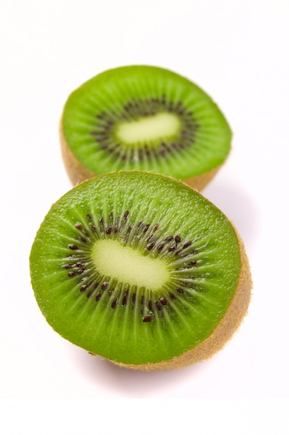 Kiwi halves on white background