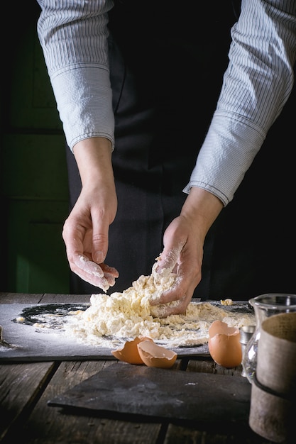 Knead the dough by female hands