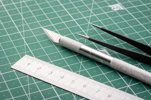 Photo knife, ruler, tweezers cutting mat