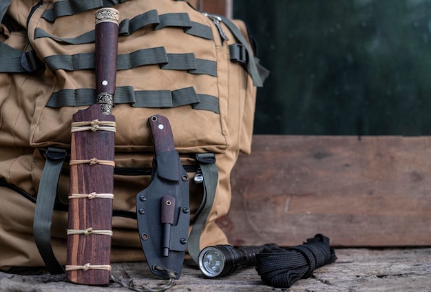 A knife with equipment for survival in the forest