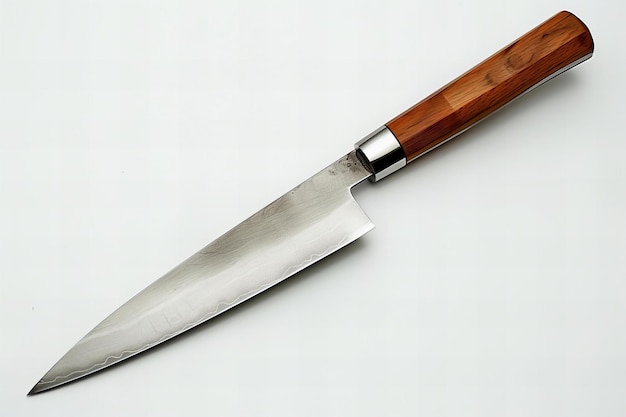 a knife with a wooden handle is laying on a white surface