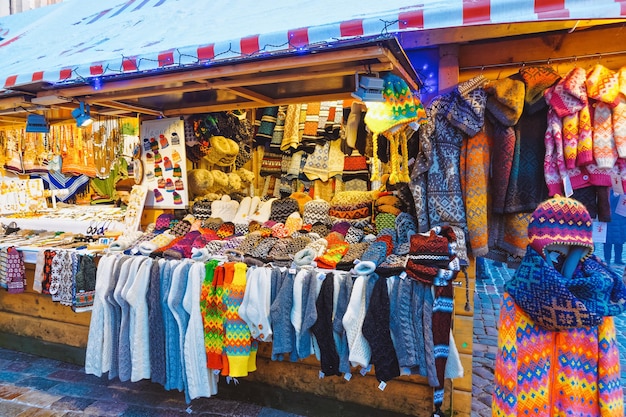 Knitted souvenirs on stalls at Christmas market in Riga in Latvia in winter.