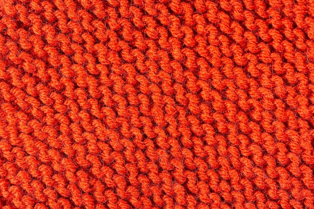 Knitted texture background. Hand-knitted wool. Macro photography of a thread drawing