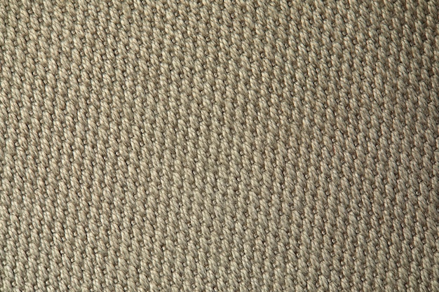 Knitted texture texture of jacquard fabric with gray beige geometric pattern crochet mosaic pattern