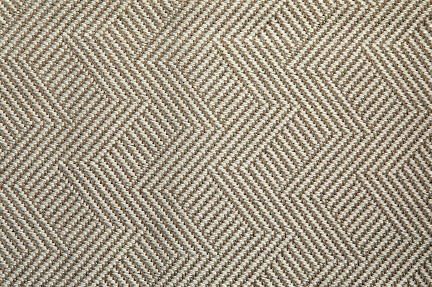 Knitted texture texture of jacquard fabric with gray beige geometric pattern crochet mosaic pattern