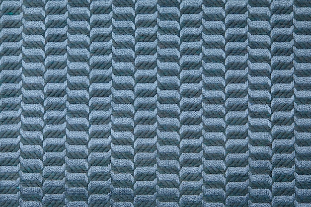 Knitted texture Texture of jacquard fabric with gray blue geometric pattern Crochet mosaic pattern