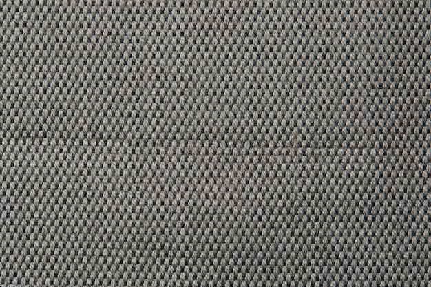 Knitted texture texture of jacquard fabric with gray geometric pattern crochet mosaic pattern