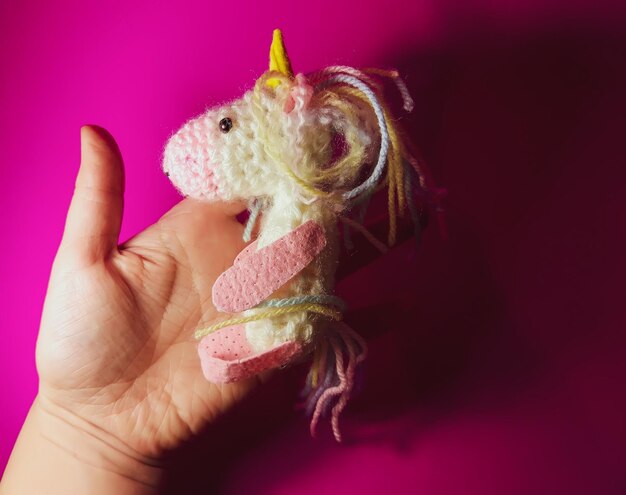 A knitted unicorn A soft handmade toy for a child