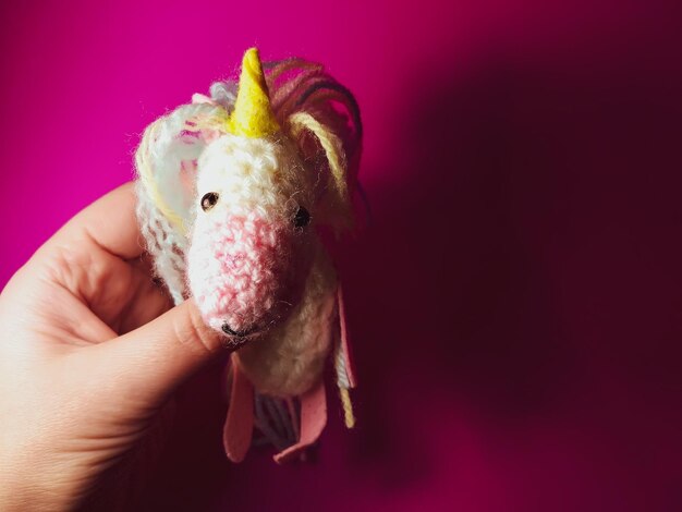 A knitted unicorn A soft handmade toy for a child