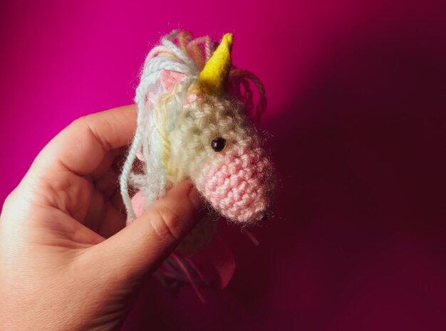 A knitted unicorn A soft handmade toy for a child