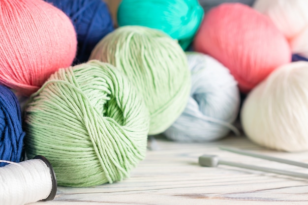 Knitting hobby composition with colorful yarn balls and needles