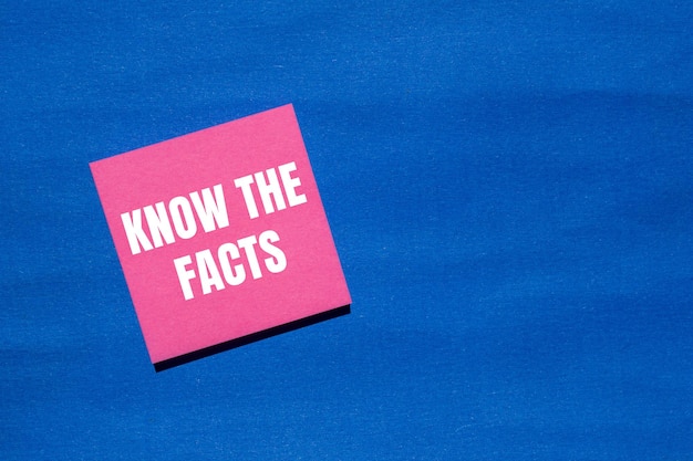 Photo know the facts message written on pink paper with blue background conceptual know the facts symbol copy space