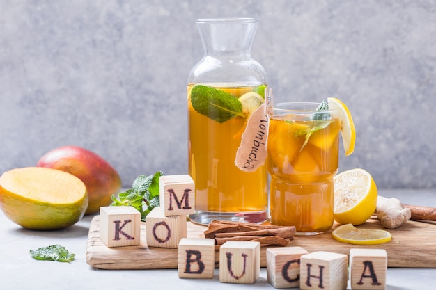 Kombucha or cider fermented drink. Cold tea beverage with beneficial bacteria, cinnamon