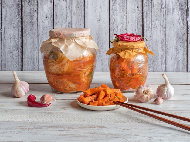 Korea kimchi pumpkin pickles on a white wooden background.