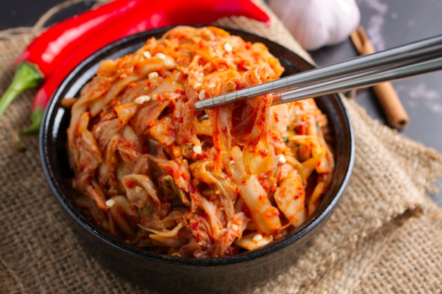 Korean food, Cabbage kimchi in black dish.