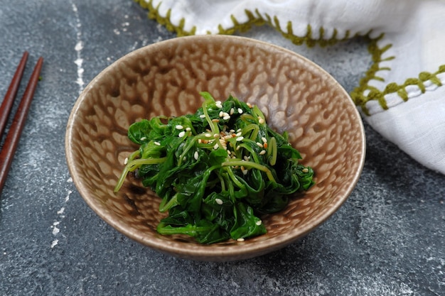 Korean  food-mixed soy sauce and spinach with sesame,Korean spinach side dish (Sigeumchi namul)