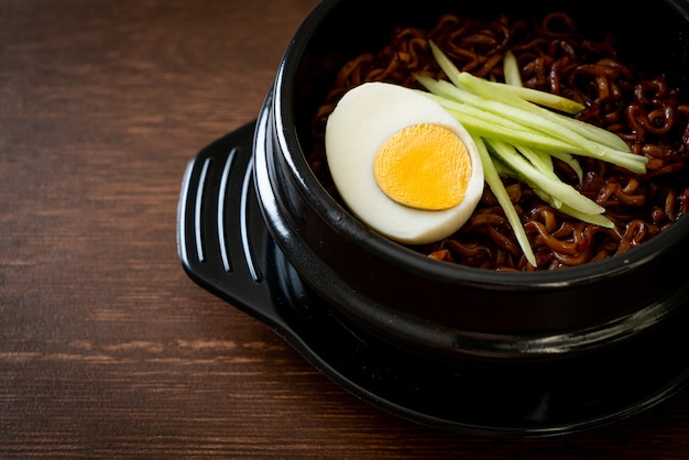 Korean Instant Noodle with Black Bean Sauce topped cucumber and boiled egg (Jajangmyeon or JJajangmyeon) - Korean food style