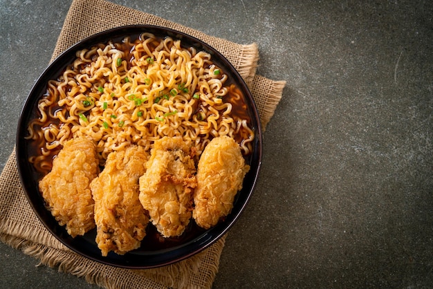 Korean instant noodles with fried chicken or Fried chicken ramyeon - Korean food style