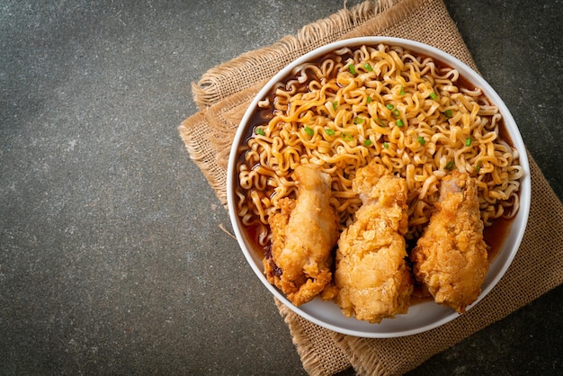 Korean instant noodles with fried chicken or Fried chicken ramyeon - Korean food style