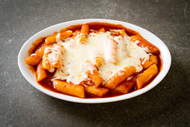 Korean rice cake in spicy Korean sauce with cheese, Cheese Tokpokki, Tteokbokki with Cheese - Korean food style