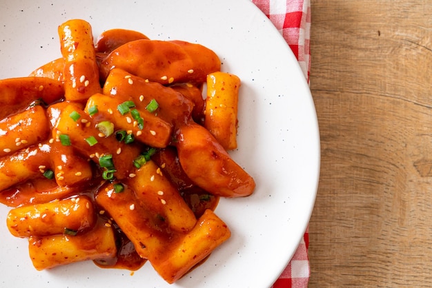 Korean rice cake stick with sausage in spicy sauce Tteokbokki