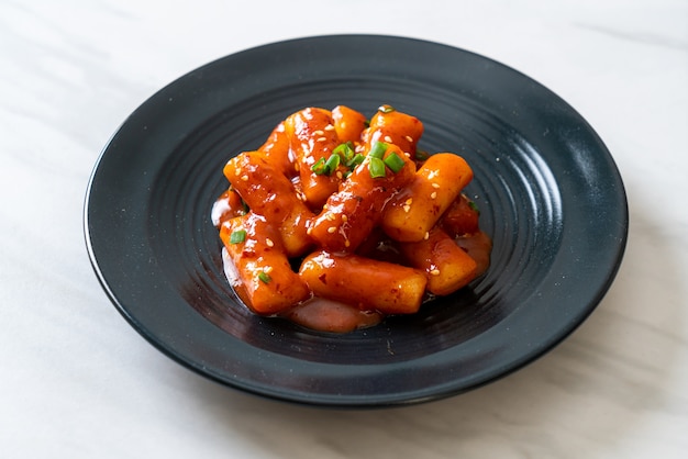 Korean rice cake sticks in spicy sauce (Tteokbokki)